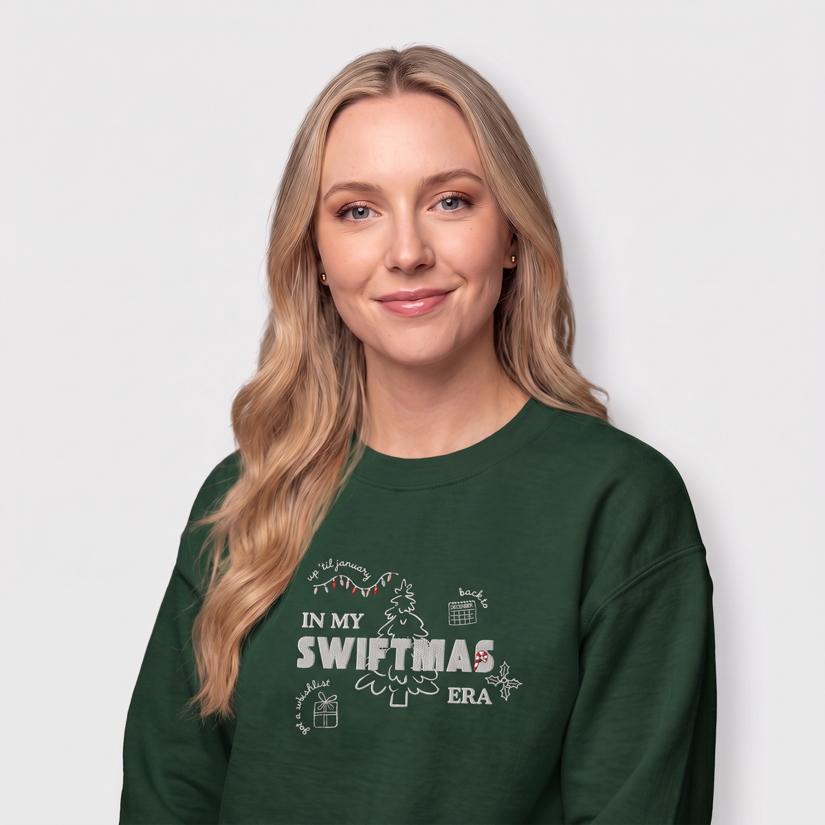 Forest green sweatshirt with red “In My Swiftmas Era” graphic featuring festive Christmas doodles, Taylor Swift inspired holiday sweatshirt for Swiftie fans