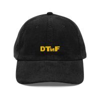 Black corduroy baseball cap with yellow embroidered ‘DTMF’ logo, inspired by Bad Bunny’s DtMF (Debí Tirar Más Fotos) era and world tour merchandise