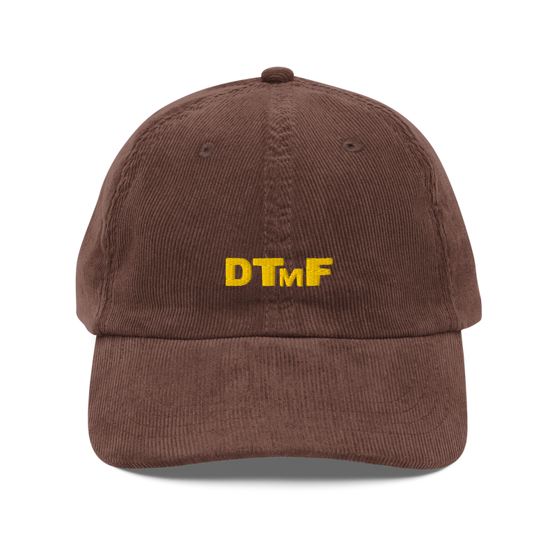 Brown corduroy baseball cap with yellow embroidered ‘DTMF’ logo, inspired by Bad Bunny’s DtMF (Debí Tirar Más Fotos) era and world tour merchandise