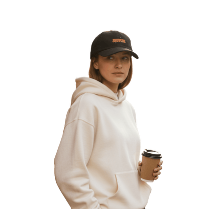 Model wearing a black Taylor Swift inspired Showgirl cap – embroidered corduroy hat for Swifties, vintage concert-style accessory with bold lettering