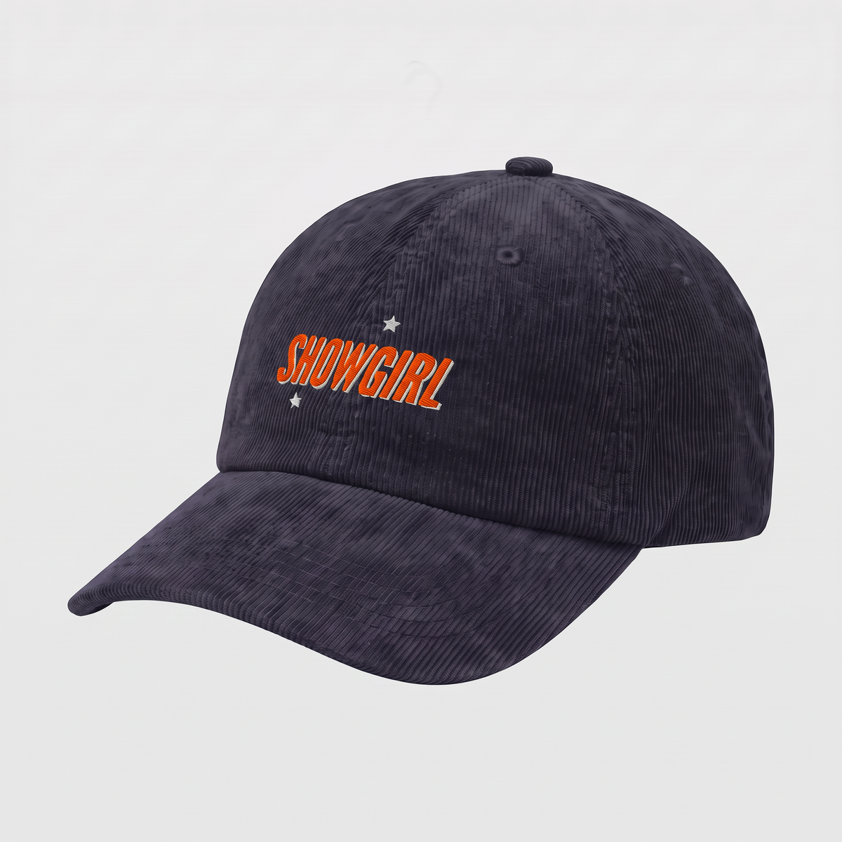 A navy blue corduroy baseball cap with 'SHOWGIRL' embroidered in orange on the front, accented by two small white stars, shown on a plain white background.