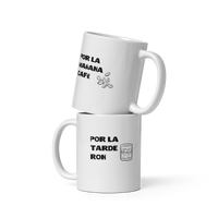 White ceramic mug with 'Por la mañana café, por la tarde ron' text, inspired by Bad Bunny, ideal for coffee and rum enthusiasts