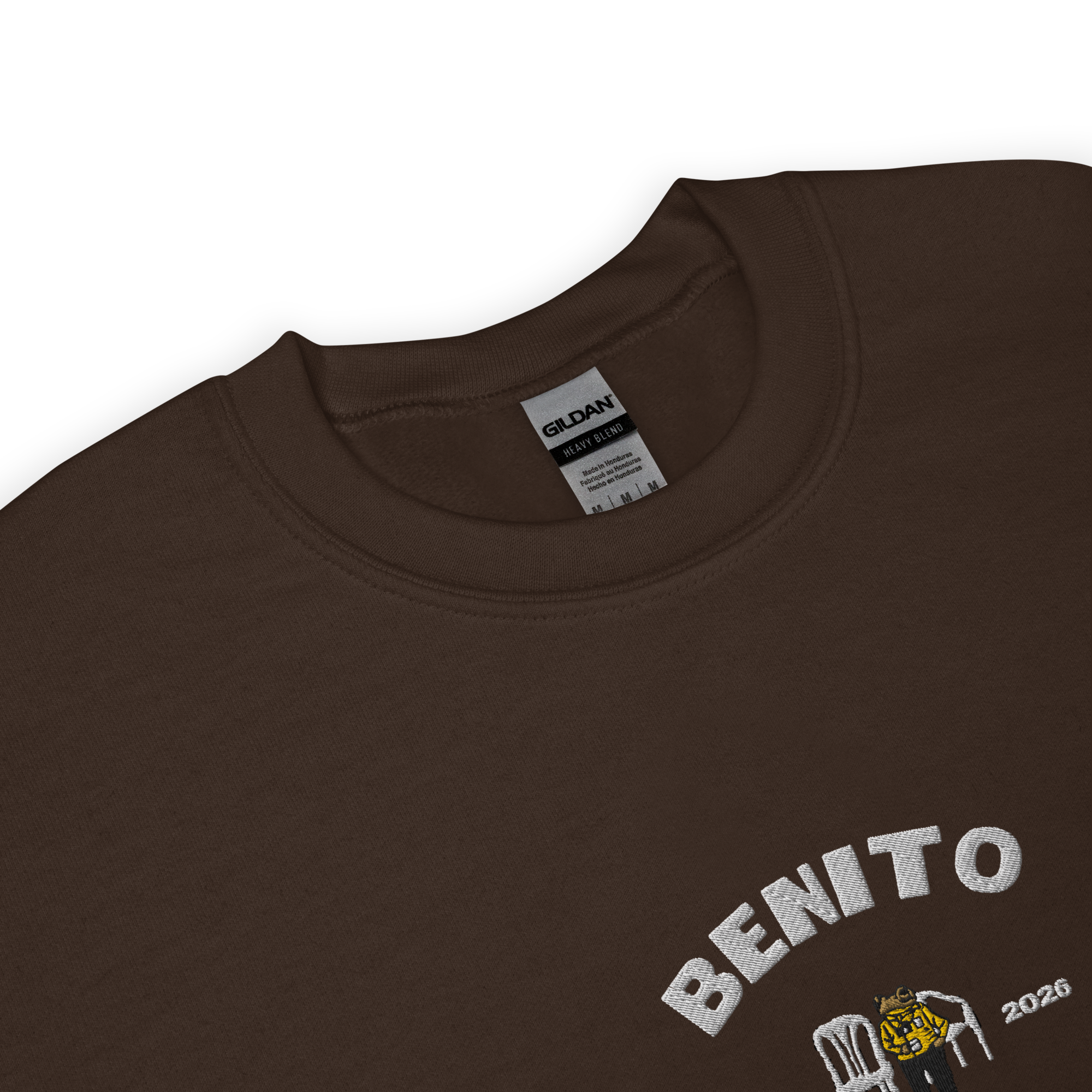Dark chocolate crewneck sweatshirt with white ‘Benito World Tour’ graphic and small central illustration, inspired by Bad Bunny merchandise, DtMF era tour apparel, and minimalist streetwear design