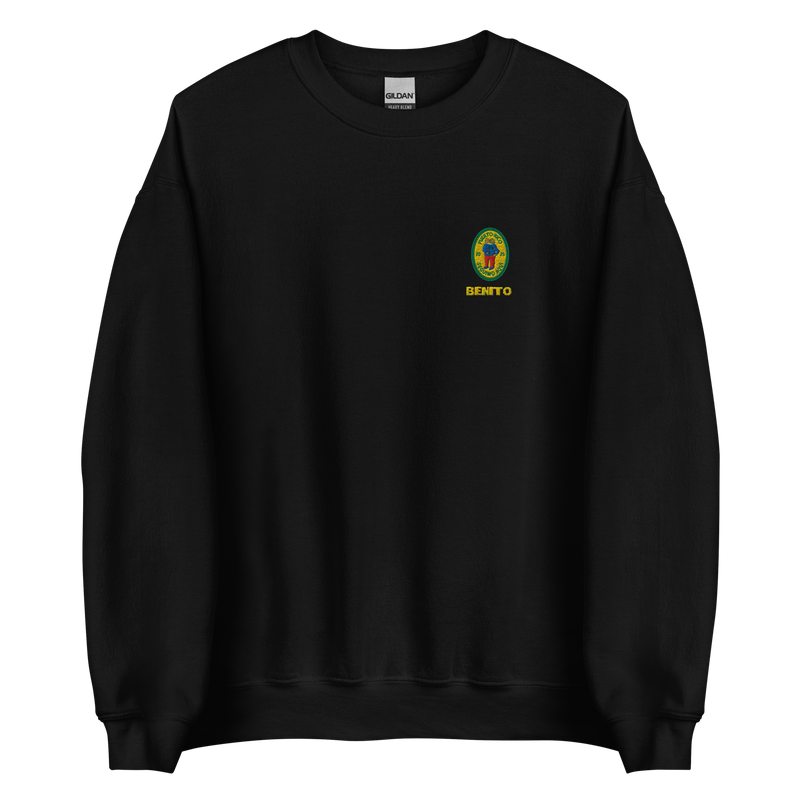 Black crewneck sweatshirt with small colorful embroidered ‘Benito’ crest logo on the chest, inspired by Bad Bunny merchandise, DtMF era streetwear, and minimalist tour-style apparel