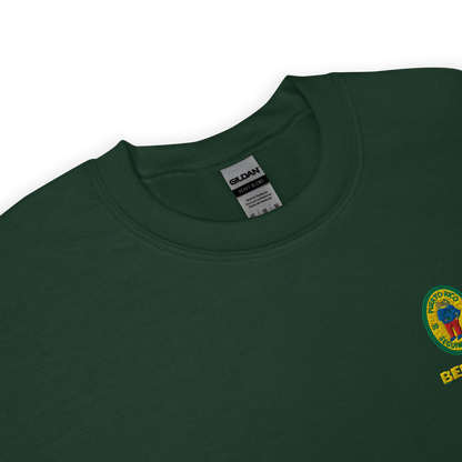 Green crewneck sweatshirt with small colorful embroidered ‘Benito’ crest logo on the chest, inspired by Bad Bunny merchandise, DtMF era streetwear, and minimalist tour-style apparel
