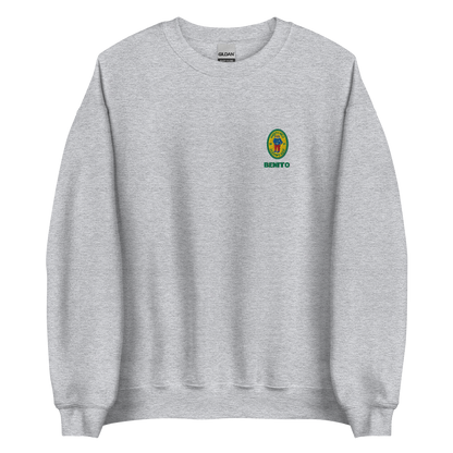 Grey crewneck sweatshirt with small colorful embroidered ‘Benito’ crest logo on the chest, inspired by Bad Bunny merchandise, DtMF era streetwear, and minimalist tour-style apparel