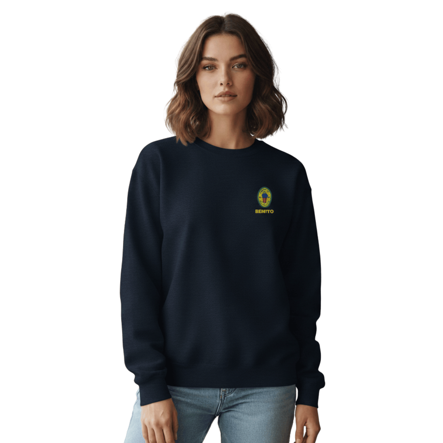 Navy crewneck sweatshirt with small colorful embroidered ‘Benito’ crest logo on the chest, inspired by Bad Bunny merchandise, DtMF era streetwear, and minimalist tour-style apparel
