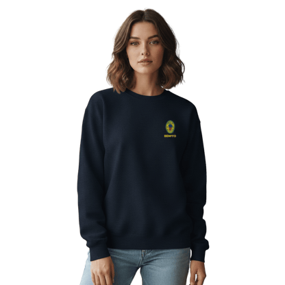Navy crewneck sweatshirt with small colorful embroidered ‘Benito’ crest logo on the chest, inspired by Bad Bunny merchandise, DtMF era streetwear, and minimalist tour-style apparel