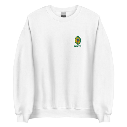 White crewneck sweatshirt with small colorful embroidered ‘Benito’ crest logo on the chest, inspired by Bad Bunny merchandise, DtMF era streetwear, and minimalist tour-style apparel
