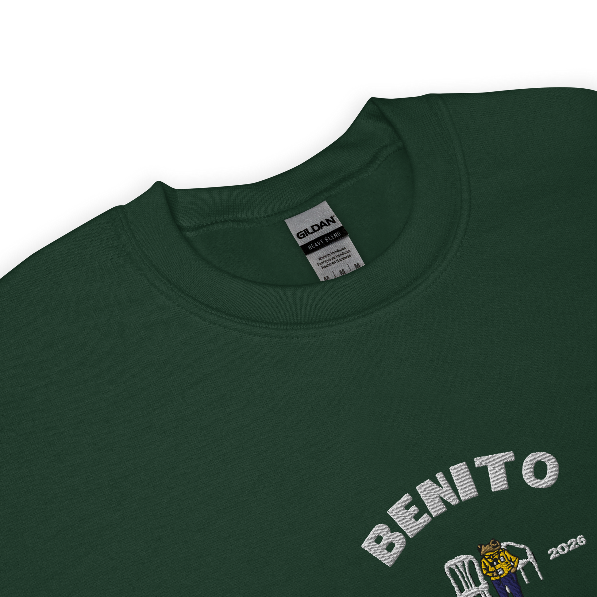 Green crewneck sweatshirt with white ‘Benito World Tour’ graphic and small central illustration, inspired by Bad Bunny merchandise, DtMF era tour apparel, and minimalist streetwear design