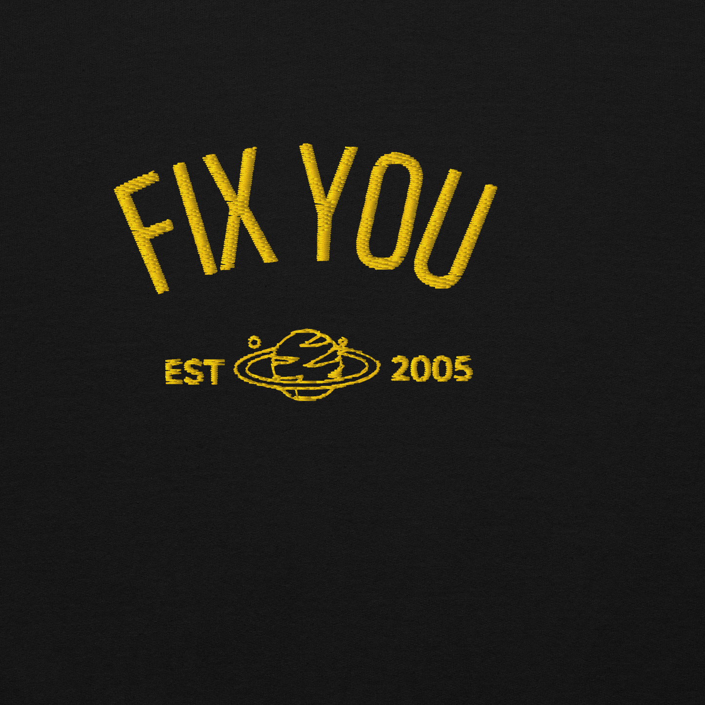 Black minimalist crewneck featuring yellow “Fix You” typography with subtle graphic detail - Coldplay inspired band merch, aesthetic Coldplay “Fix You” song fan apparel