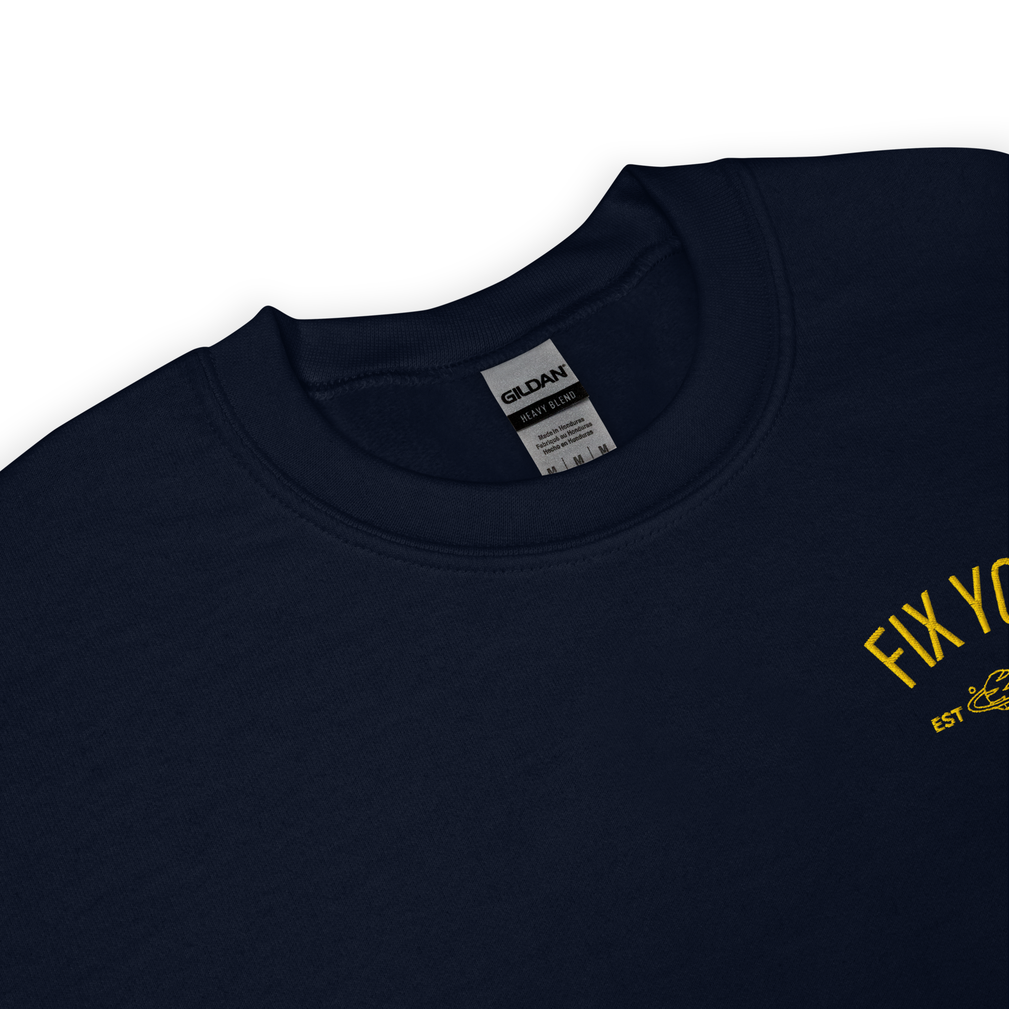 Navy blue minimalist crewneck featuring yellow “Fix You” typography with subtle graphic detail - Coldplay inspired band merch, aesthetic Coldplay “Fix You” song fan apparel