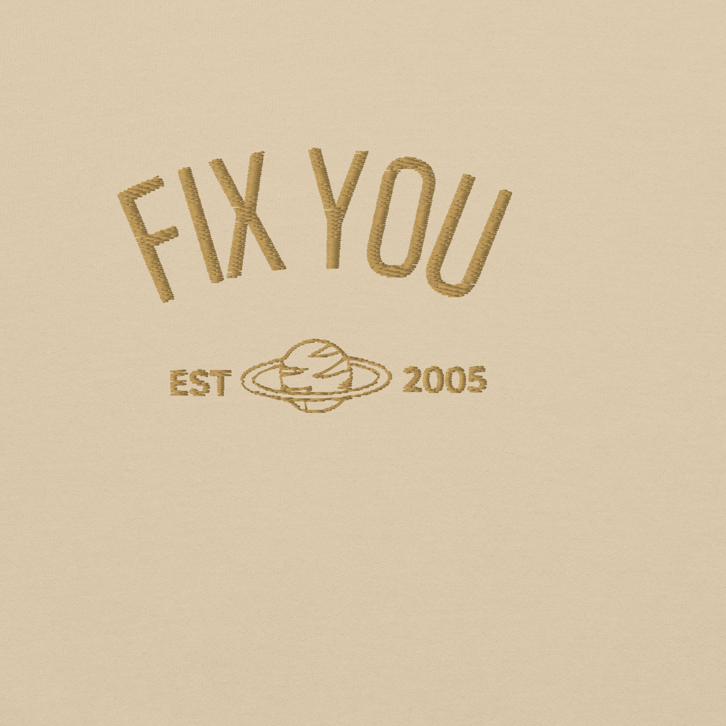Sand minimalist crewneck featuring maroon “Fix You” typography with subtle graphic detail - Coldplay inspired band merch, aesthetic Coldplay “Fix You” song fan apparel