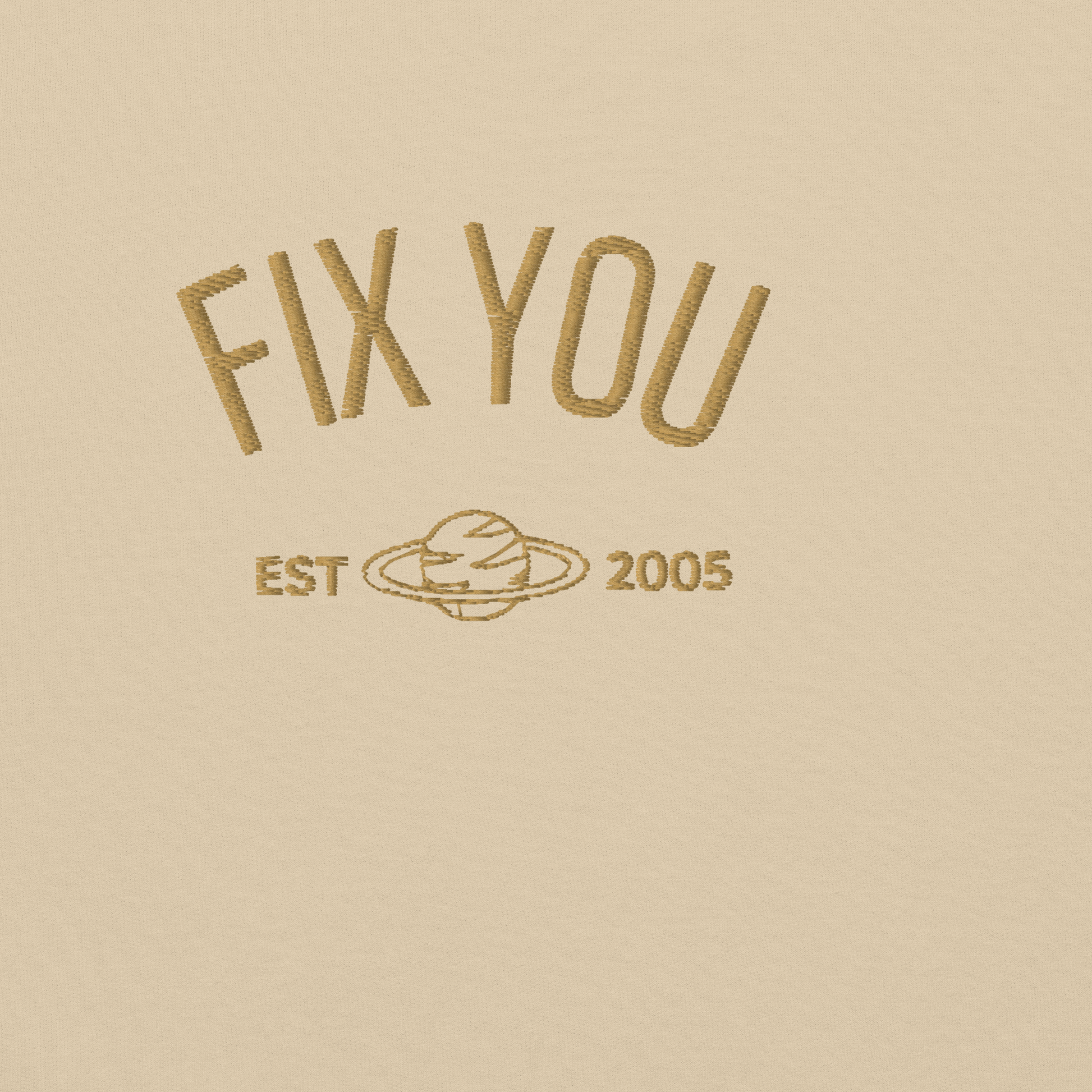 Sand minimalist crewneck featuring maroon “Fix You” typography with subtle graphic detail - Coldplay inspired band merch, aesthetic Coldplay “Fix You” song fan apparel
