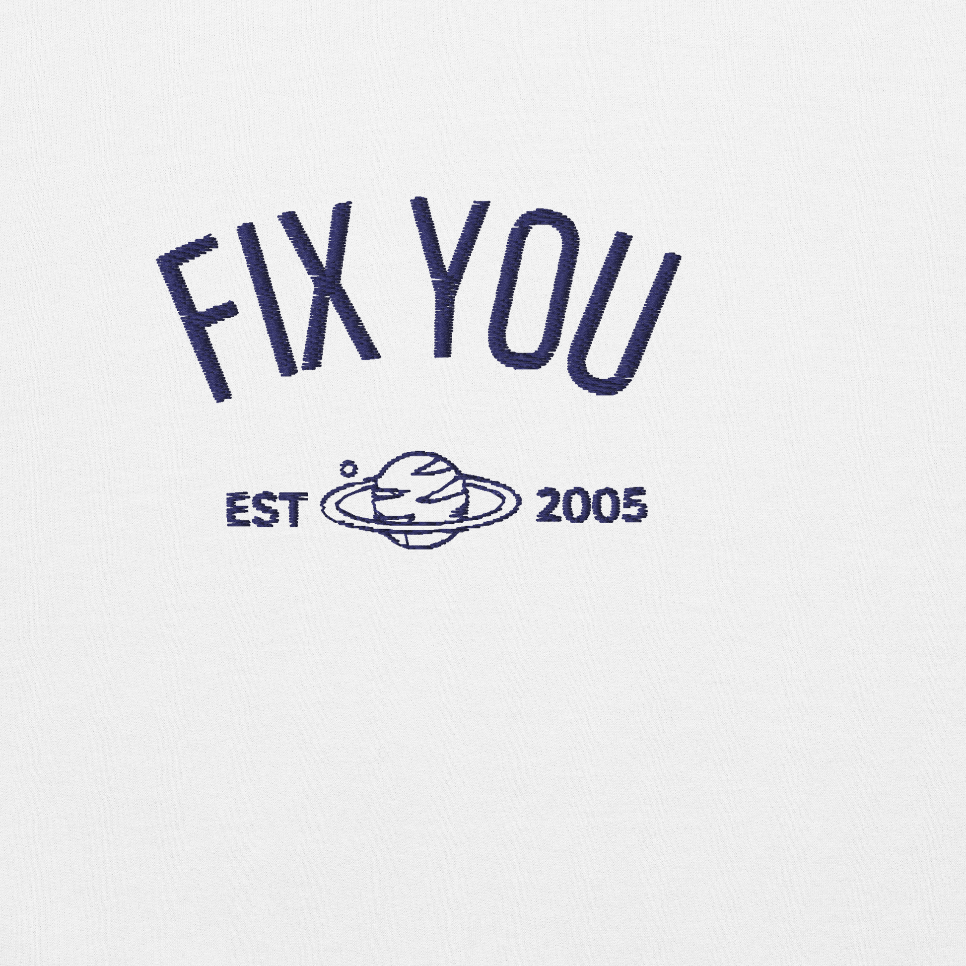 White minimalist crewneck featuring blue “Fix You” typography with subtle graphic detail - Coldplay inspired band merch, aesthetic Coldplay “Fix You” song fan apparel