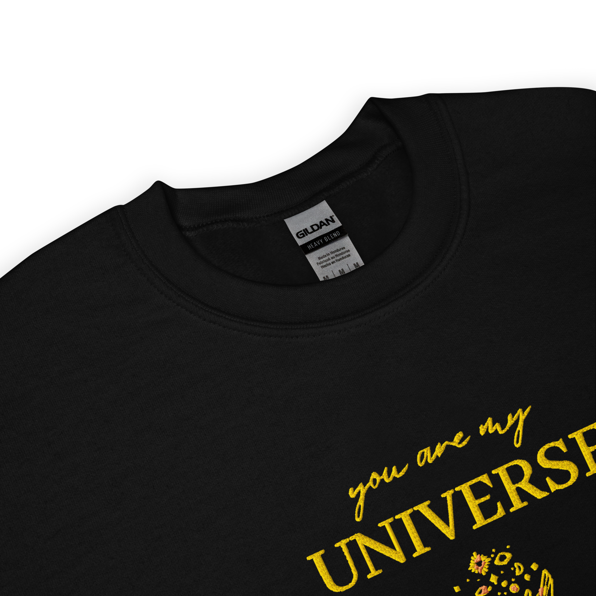 Black crewneck sweatshirt featuring yellow typography that reads “you are my Universe” with minimalist hands holding stars illustration -inspired by Coldplay’s hit song “My Universe”, aesthetic fan apparel for music lovers.