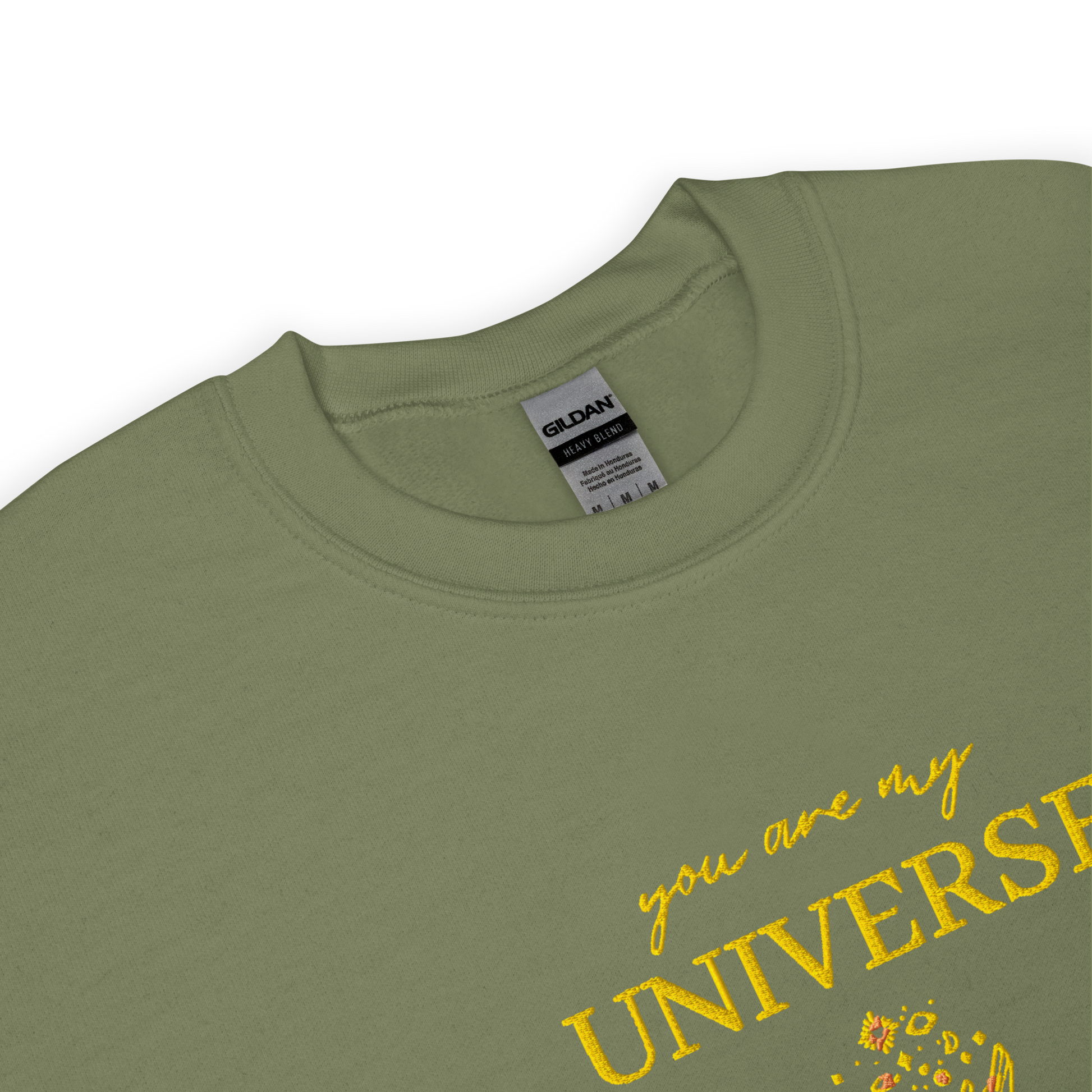 Green crewneck sweatshirt featuring yellow typography that reads “you are my Universe” with minimalist hands holding stars illustration -inspired by Coldplay’s hit song “My Universe”, aesthetic fan apparel for music lovers.