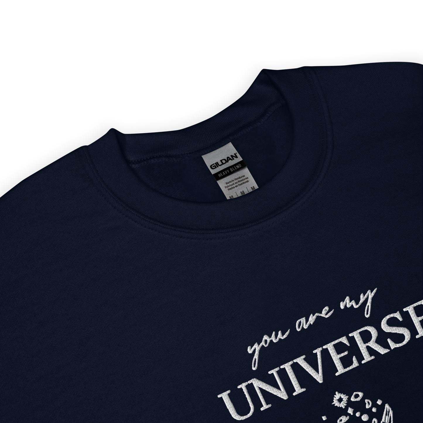 Navy crewneck sweatshirt featuring white typography that reads “you are my Universe” with minimalist hands holding stars illustration -inspired by Coldplay’s hit song “My Universe”, aesthetic fan apparel for music lovers.