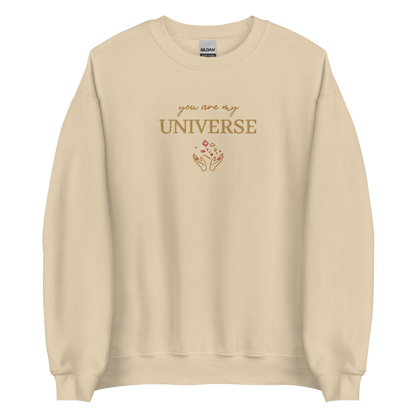 Sand crewneck sweatshirt featuring yellow typography that reads “you are my Universe” with minimalist hands holding stars illustration -inspired by Coldplay’s hit song “My Universe”, aesthetic fan apparel for music lovers