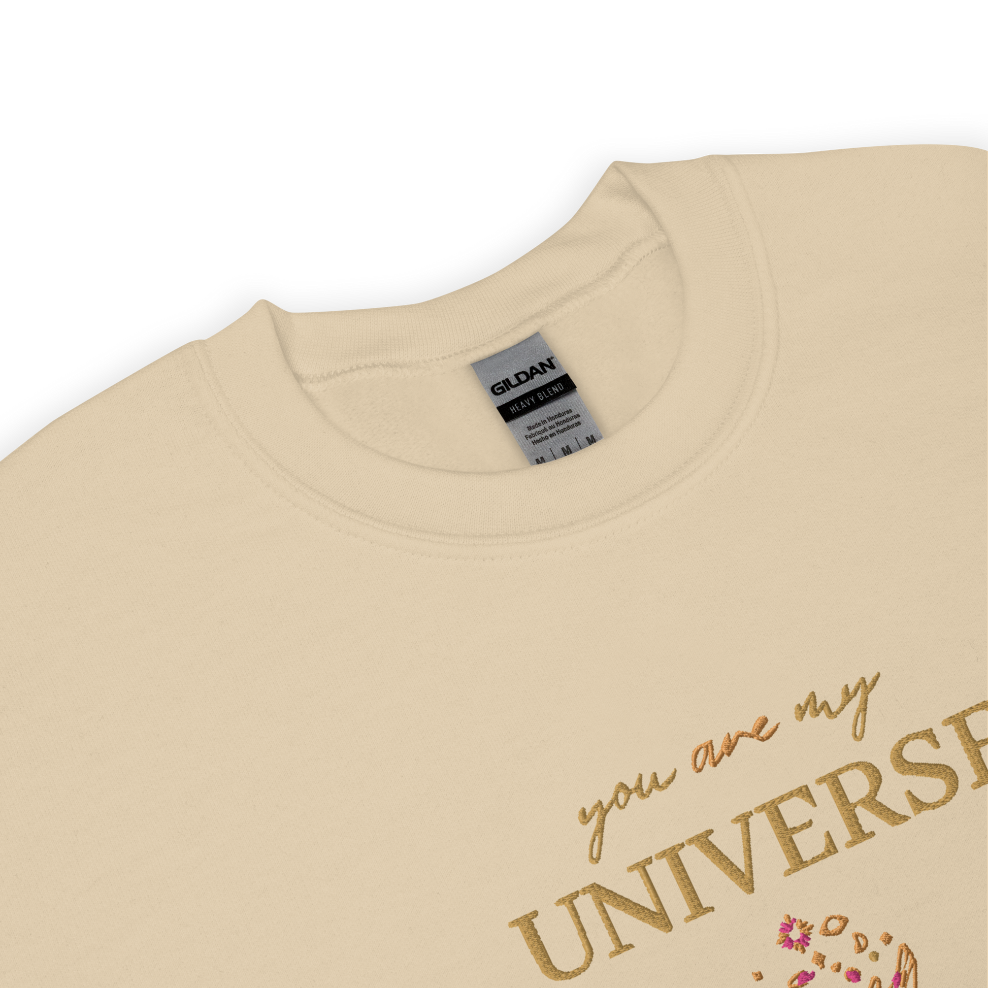 Sand crewneck sweatshirt featuring yellow typography that reads “you are my Universe” with minimalist hands holding stars illustration -inspired by Coldplay’s hit song “My Universe”, aesthetic fan apparel for music lovers
