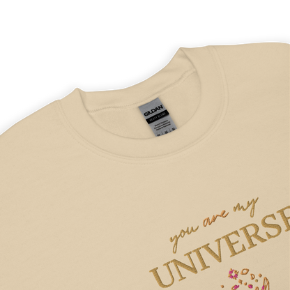 Sand crewneck sweatshirt featuring yellow typography that reads “you are my Universe” with minimalist hands holding stars illustration -inspired by Coldplay’s hit song “My Universe”, aesthetic fan apparel for music lovers