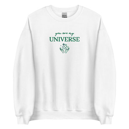 White crewneck sweatshirt featuring green typography that reads “you are my Universe” with minimalist hands holding stars illustration -inspired by Coldplay’s hit song “My Universe”, aesthetic fan apparel for music lovers.