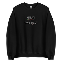 Black sweatshirt with "Merry Swiftmas" embroidered text with a stocking garland and candy cane, holiday Taylor Swift design