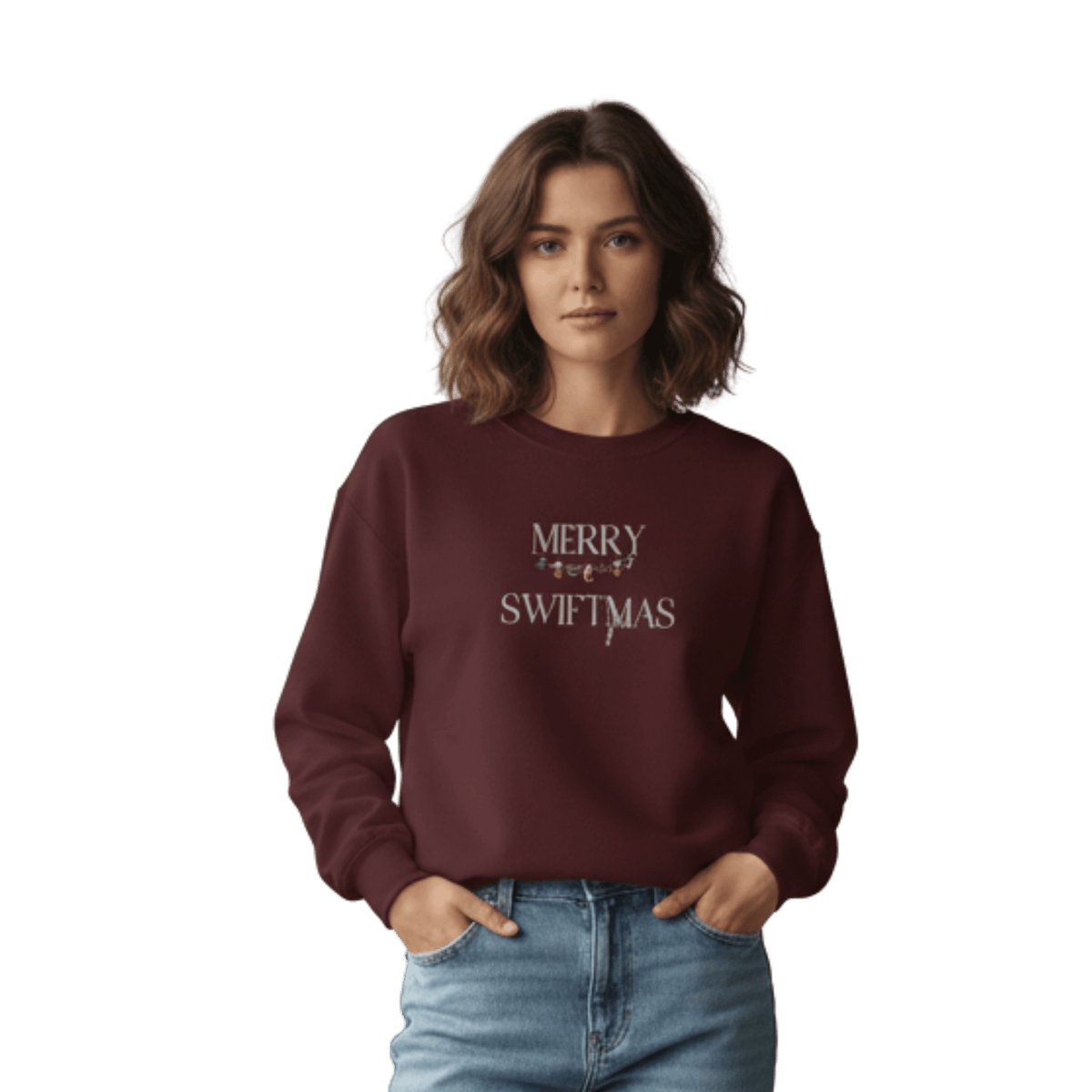 Model wearing a maroon sweatshirt with "Merry Swiftmas" embroidered text with a stocking garland and candy cane, holiday Taylor Swift design