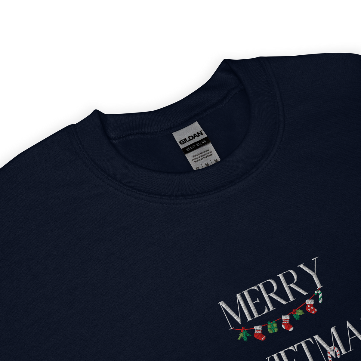Navy sweatshirt, close-up view of "Merry Swiftmas" embroidered text with a stocking garland and candy cane, holiday Taylor Swift design