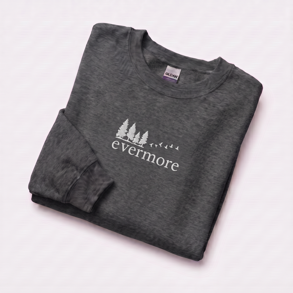 Folded dark heather evermore era sweatshirt, Taylor Swift-inspired embroidered forest and bird design, cozy cottagecore crewneck for Swifties