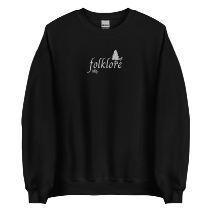 Black folklore sweatshirt inspired by Taylor Swift’s folklore era, featuring minimalist gold ‘folklore’ lettering and tree graphic on a cozy crewneck pullover, aesthetic indie music merch