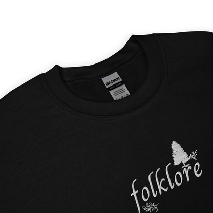 Black folklore sweatshirt inspired by Taylor Swift’s folklore era, featuring minimalist gold ‘folklore’ lettering and tree graphic on a cozy crewneck pullover, aesthetic indie music merch