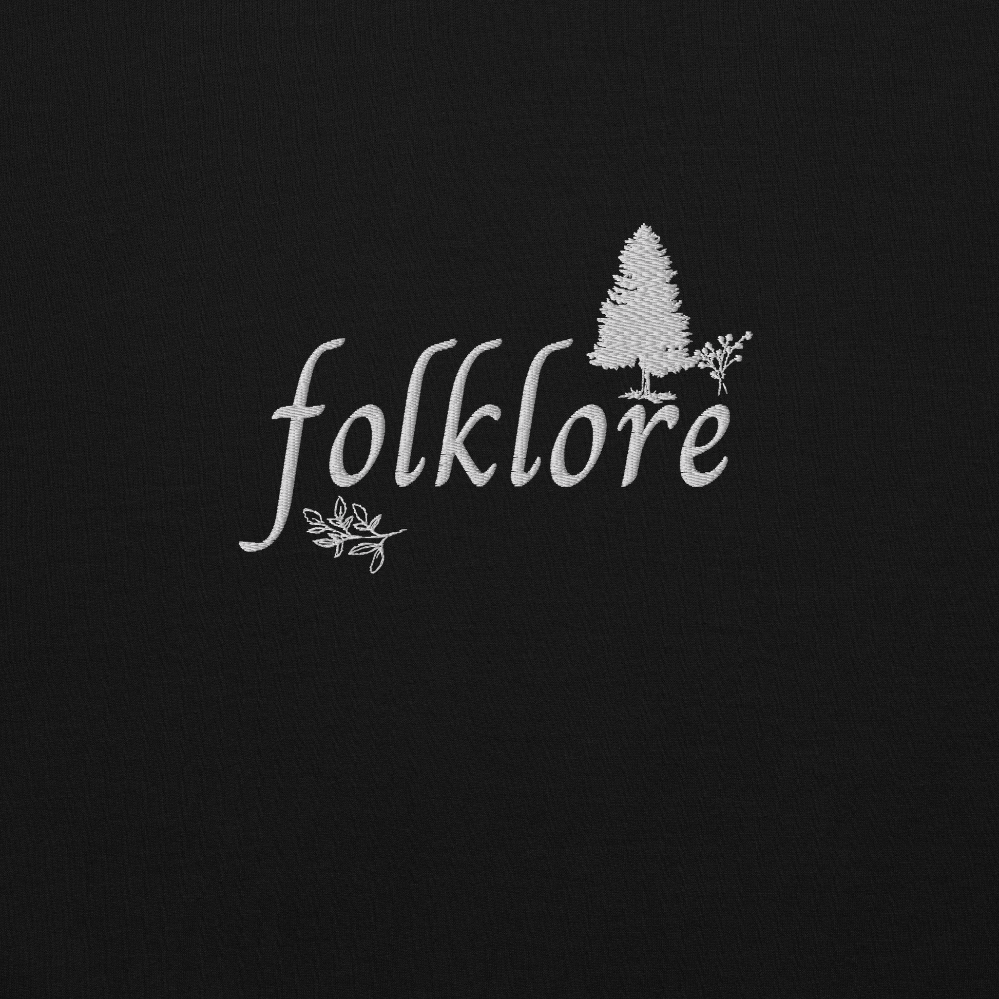 Black folklore sweatshirt inspired by Taylor Swift’s folklore era, featuring minimalist gold ‘folklore’ lettering and tree graphic on a cozy crewneck pullover, aesthetic indie music merch