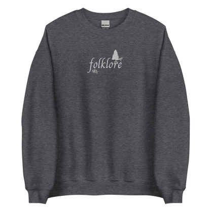 Dark heather folklore sweatshirt inspired by Taylor Swift’s folklore era, featuring minimalist gold ‘folklore’ lettering and tree graphic on a cozy crewneck pullover, aesthetic indie music merch