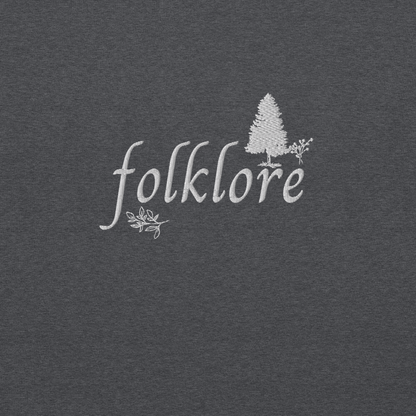 Dark heather folklore sweatshirt inspired by Taylor Swift’s folklore era, featuring minimalist gold ‘folklore’ lettering and tree graphic on a cozy crewneck pullover, aesthetic indie music merch