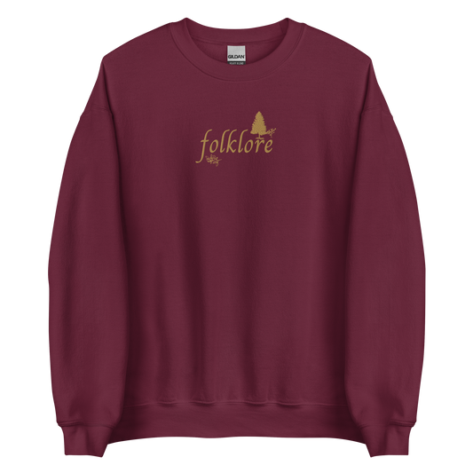 Maroon folklore sweatshirt inspired by Taylor Swift’s folklore era, featuring minimalist gold ‘folklore’ lettering and tree graphic on a cozy crewneck pullover, aesthetic indie music merch