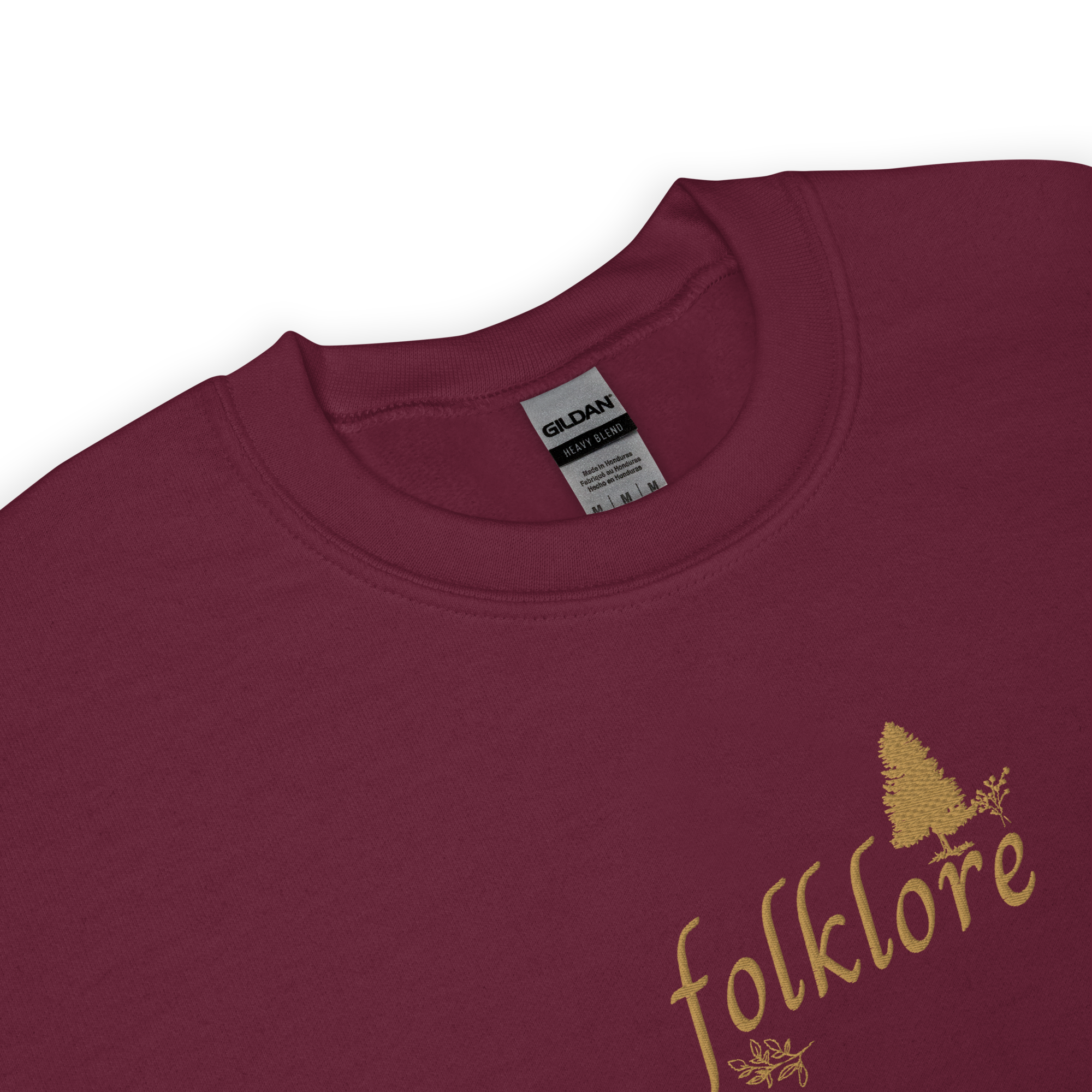 Maroon folklore sweatshirt inspired by Taylor Swift’s folklore era, featuring minimalist gold ‘folklore’ lettering and tree graphic on a cozy crewneck pullover, aesthetic indie music merch