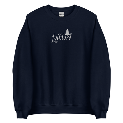Navy folklore sweatshirt inspired by Taylor Swift’s folklore era, featuring minimalist gold ‘folklore’ lettering and tree graphic on a cozy crewneck pullover, aesthetic indie music merch