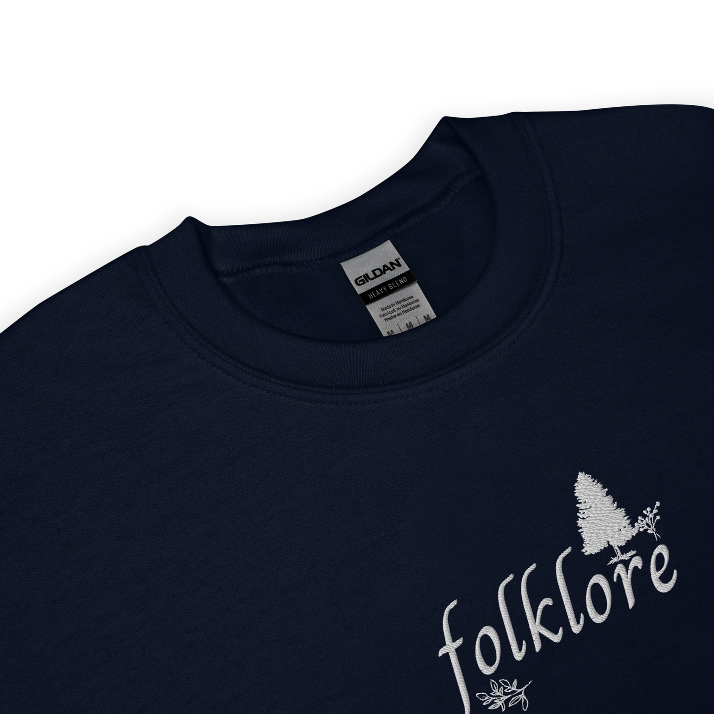 Navy folklore sweatshirt inspired by Taylor Swift’s folklore era, featuring minimalist gold ‘folklore’ lettering and tree graphic on a cozy crewneck pullover, aesthetic indie music merch