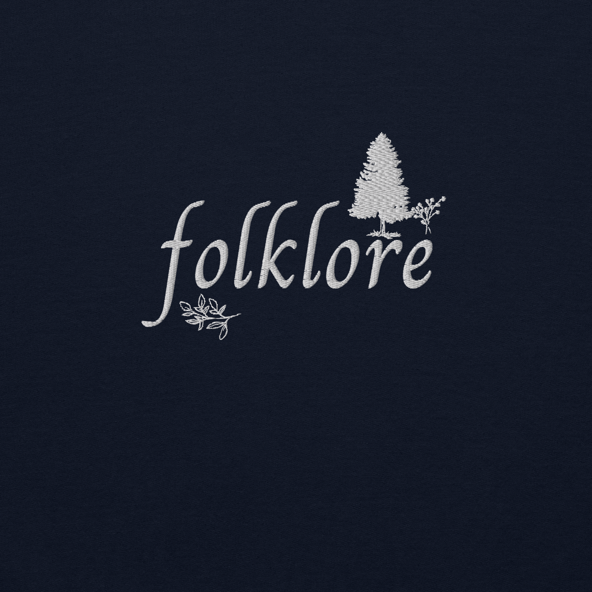 Navy folklore sweatshirt inspired by Taylor Swift’s folklore era, featuring minimalist gold ‘folklore’ lettering and tree graphic on a cozy crewneck pullover, aesthetic indie music merch
