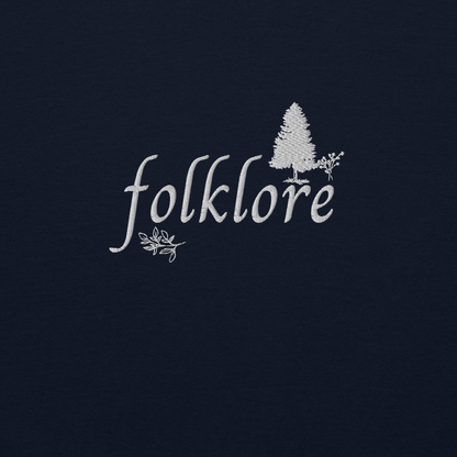 Navy folklore sweatshirt inspired by Taylor Swift’s folklore era, featuring minimalist gold ‘folklore’ lettering and tree graphic on a cozy crewneck pullover, aesthetic indie music merch