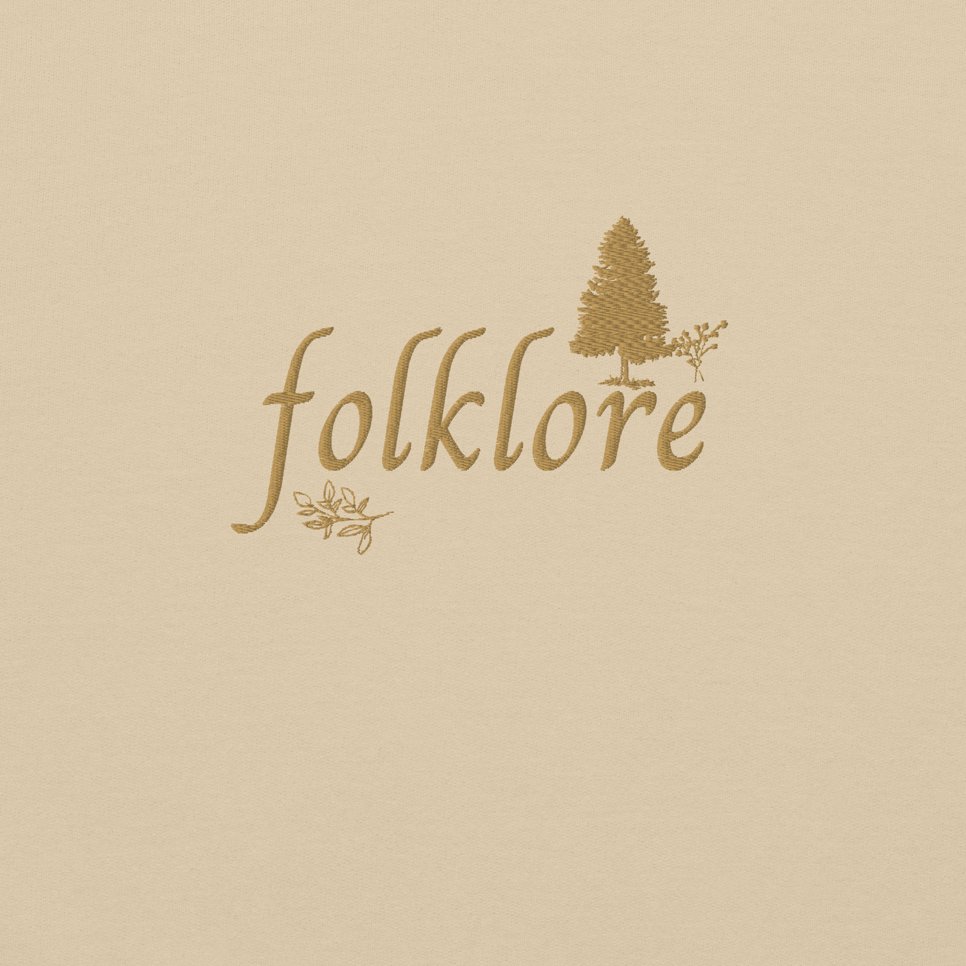 Sand folklore sweatshirt inspired by Taylor Swift’s folklore era, featuring minimalist gold ‘folklore’ lettering and tree graphic on a cozy crewneck pullover, aesthetic indie music merch