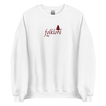 White folklore sweatshirt inspired by Taylor Swift’s folklore era, featuring minimalist gold ‘folklore’ lettering and tree graphic on a cozy crewneck pullover, aesthetic indie music merch
