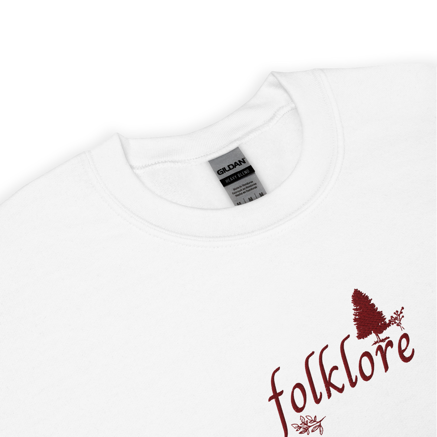 White folklore sweatshirt inspired by Taylor Swift’s folklore era, featuring minimalist gold ‘folklore’ lettering and tree graphic on a cozy crewneck pullover, aesthetic indie music merch