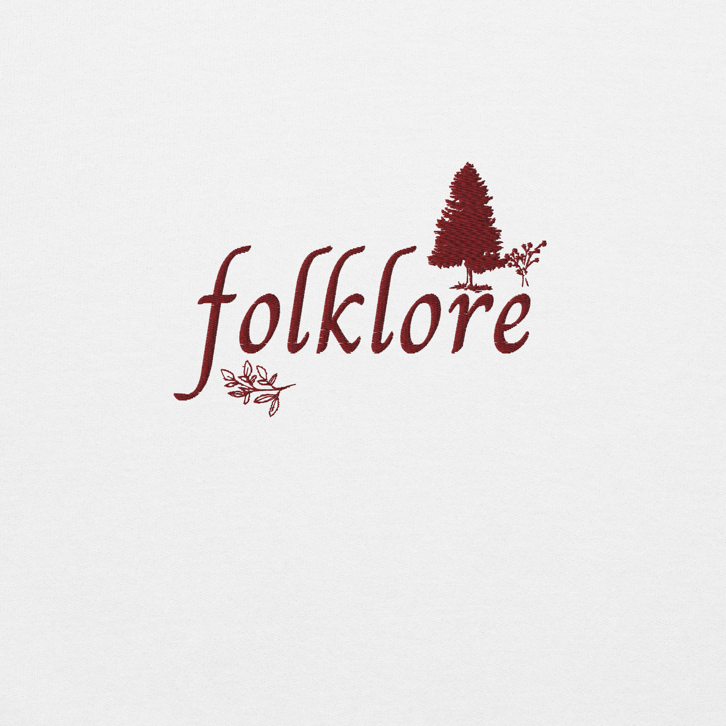 White folklore sweatshirt inspired by Taylor Swift’s folklore era, featuring minimalist gold ‘folklore’ lettering and tree graphic on a cozy crewneck pullover, aesthetic indie music merch