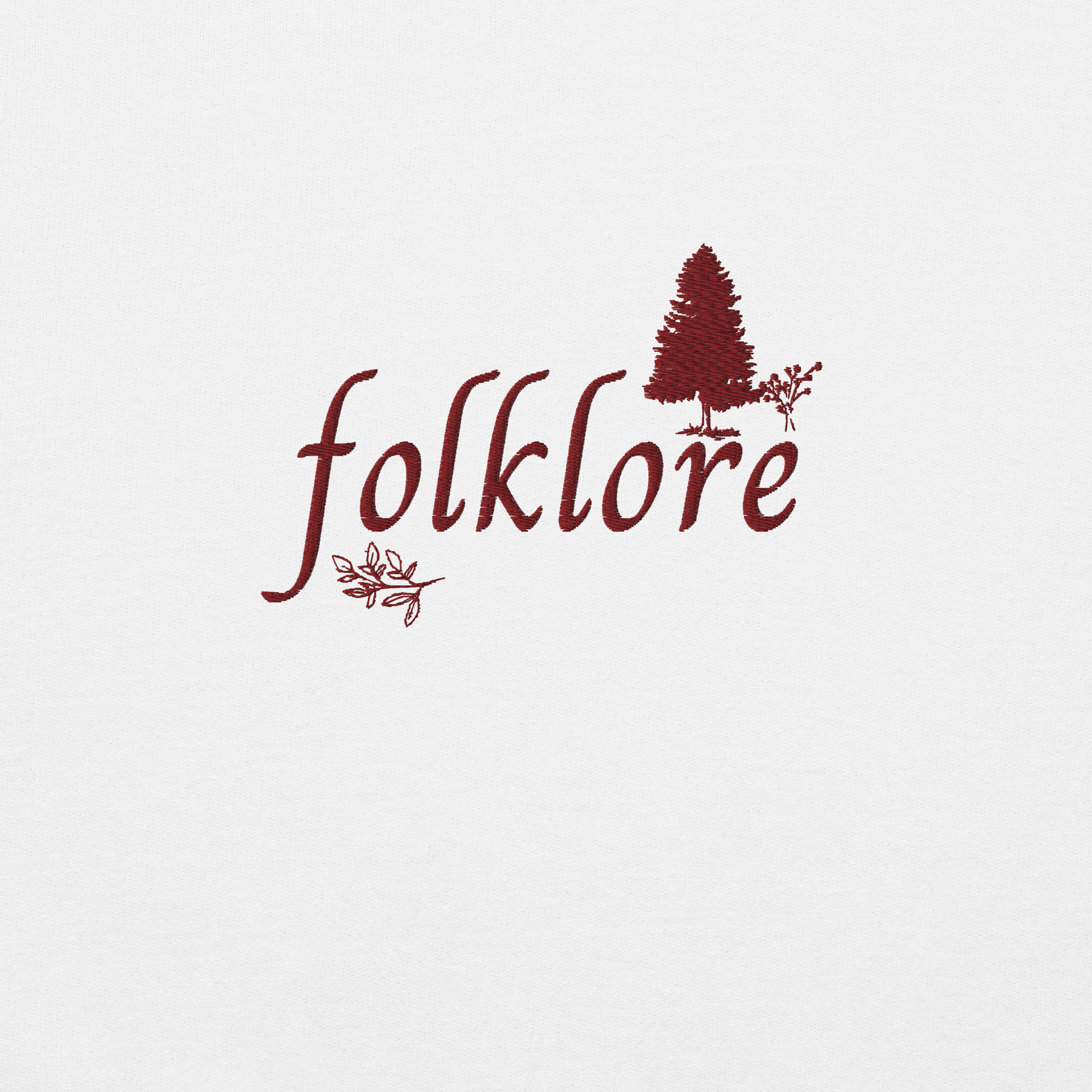 White folklore sweatshirt inspired by Taylor Swift’s folklore era, featuring minimalist gold ‘folklore’ lettering and tree graphic on a cozy crewneck pullover, aesthetic indie music merch