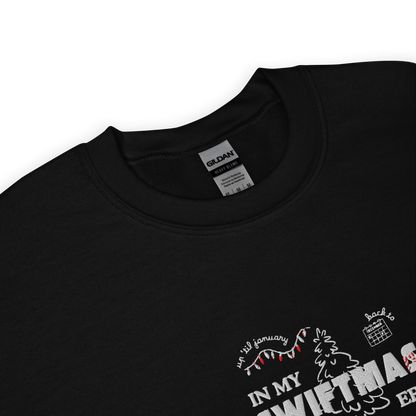 Black sweatshirt with red “In My Swiftmas Era” graphic featuring festive Christmas doodles, Taylor Swift inspired holiday sweatshirt for Swiftie fans