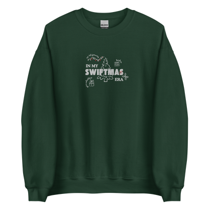 Forest green sweatshirt with red “In My Swiftmas Era” graphic featuring festive Christmas doodles, Taylor Swift inspired holiday sweatshirt for Swiftie fans