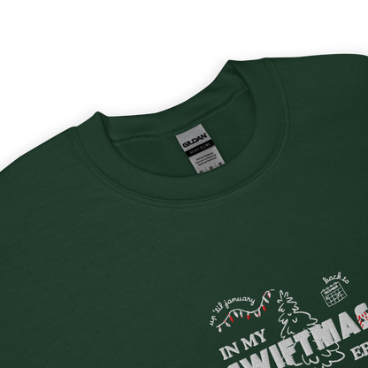 Forest green sweatshirt with red “In My Swiftmas Era” graphic featuring festive Christmas doodles, Taylor Swift inspired holiday sweatshirt for Swiftie fans