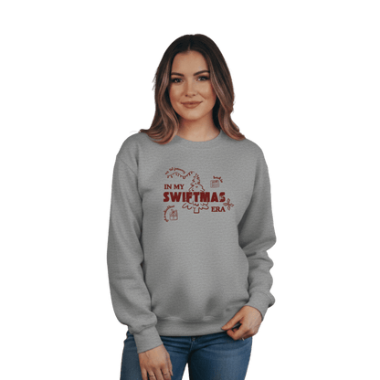 Grey sweatshirt with red “In My Swiftmas Era” graphic featuring festive Christmas doodles, Taylor Swift inspired holiday sweatshirt for Swiftie fans